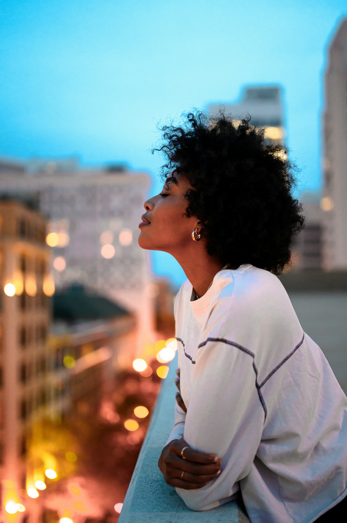Young African woman outdoors at dusk